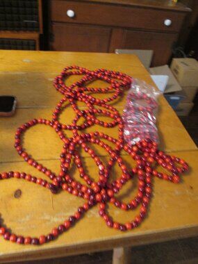 3 strands of cranberry wooded beads vtg 80s 105 in each strand for the tree
